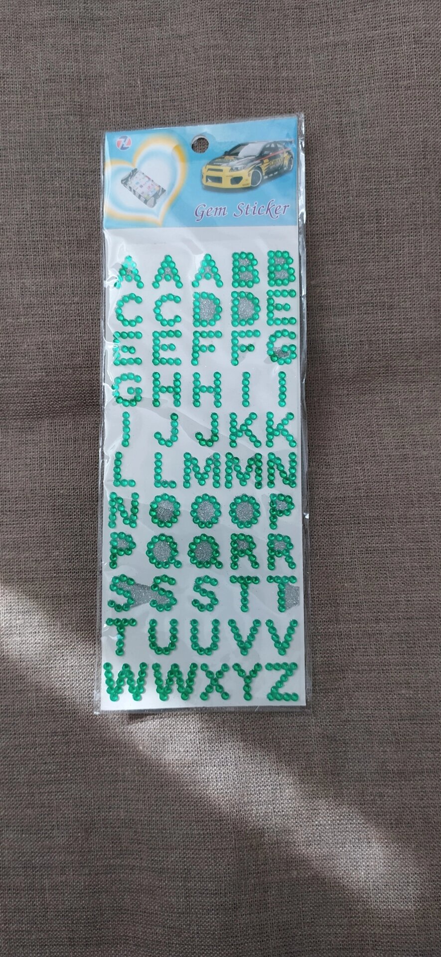 Стразы самоклеющиеся на листе 9/20см  (зеленый алфавит) от компании Магазин ШвейМаг - фото 1