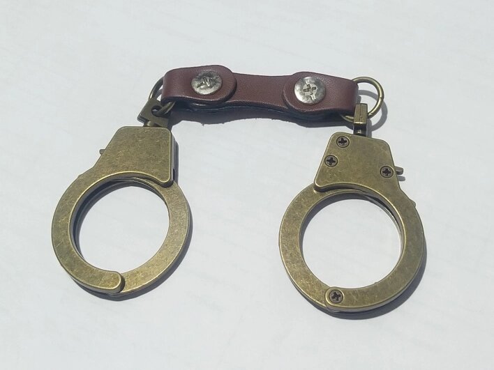 Металлический брелок -  наручники от компании R.R.R. Бижутерия и украшения оптом - фото 1