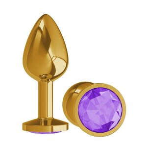 Сумерки Богов - Золотистая анальная втулка с кристаллом, 7х2.7 см. (фиолетовый)