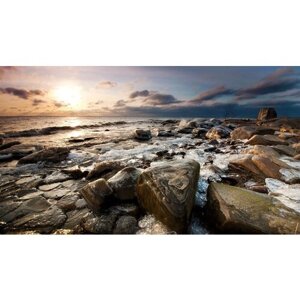 Картина на холсте 60x110 Альянс Лес "Закат лёд камни море" на подрамнике / интерьер/ декор