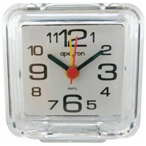 Будильник-часы PLT20-001 в форме квадрата с корпусом и рассеивателем из качественного пластика. Лицевая сторона защищена пластиковым стеклом. На циферблате белого цвета расположены арабские цифры и три стрелки.